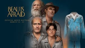 Official 'Beau is Afraid' prop and costume auction key art featuring Joaquin Phoenix in a surreal journey setting