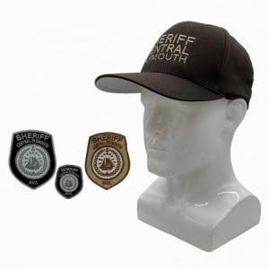 Lot #399: Thanksgiving Sheriff Newlon Patrick Dempsey Production Worn Hat & Patch Set