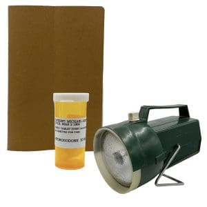 Lot #159: The Iron Claw Mike Von Erich Stanley Simons Screen Used Flashlight, Note & Medication Bottle