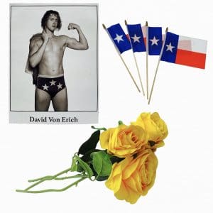 Lot #179: The Iron Claw David Von Erich Harris Dickinson Screen Used Photograph, 4 Flags & 3 Roses