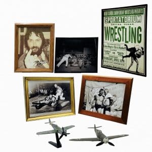 Lot #113: The Iron Claw Fritz Von Erich Holt McCallany Screen Used Framed Photo Set, Autographed Framed Photo, Event Poster, Model Plane W/ Stand & Model Plane