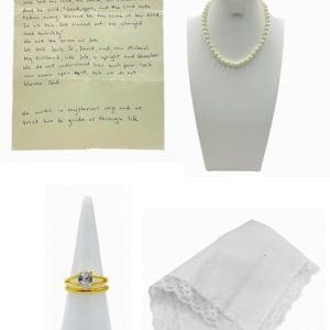 Lot #186: The Iron Claw Doris Von Erich Maura Tierney Screen Used Funeral Letter, Handkerchief, Necklace, Wedding Ring Set & Watch